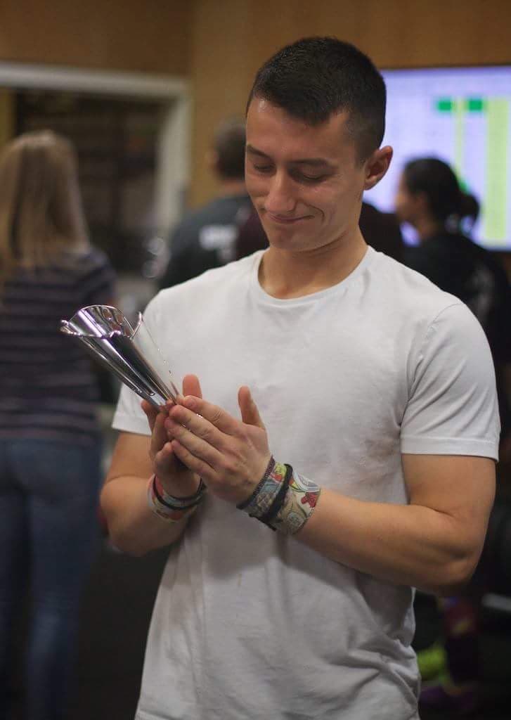 Nick holding a competition trophy